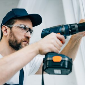 adult-repairman-in-goggles-fixing-window-handle-by-electric-drill.jpg adult-repairman-in-goggles-fixing-window-handle-by-electric-drill.jpg